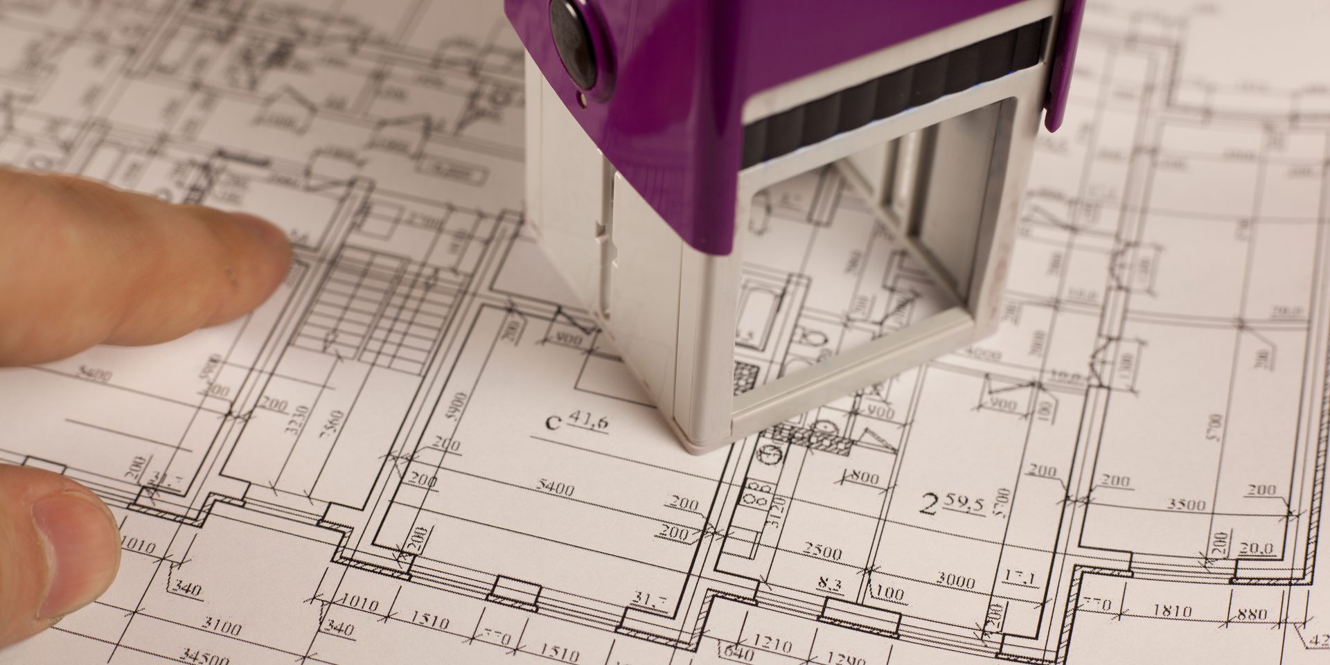 Stamp,With,Finger,On,Plan,Of,House,Background.,Finance,And